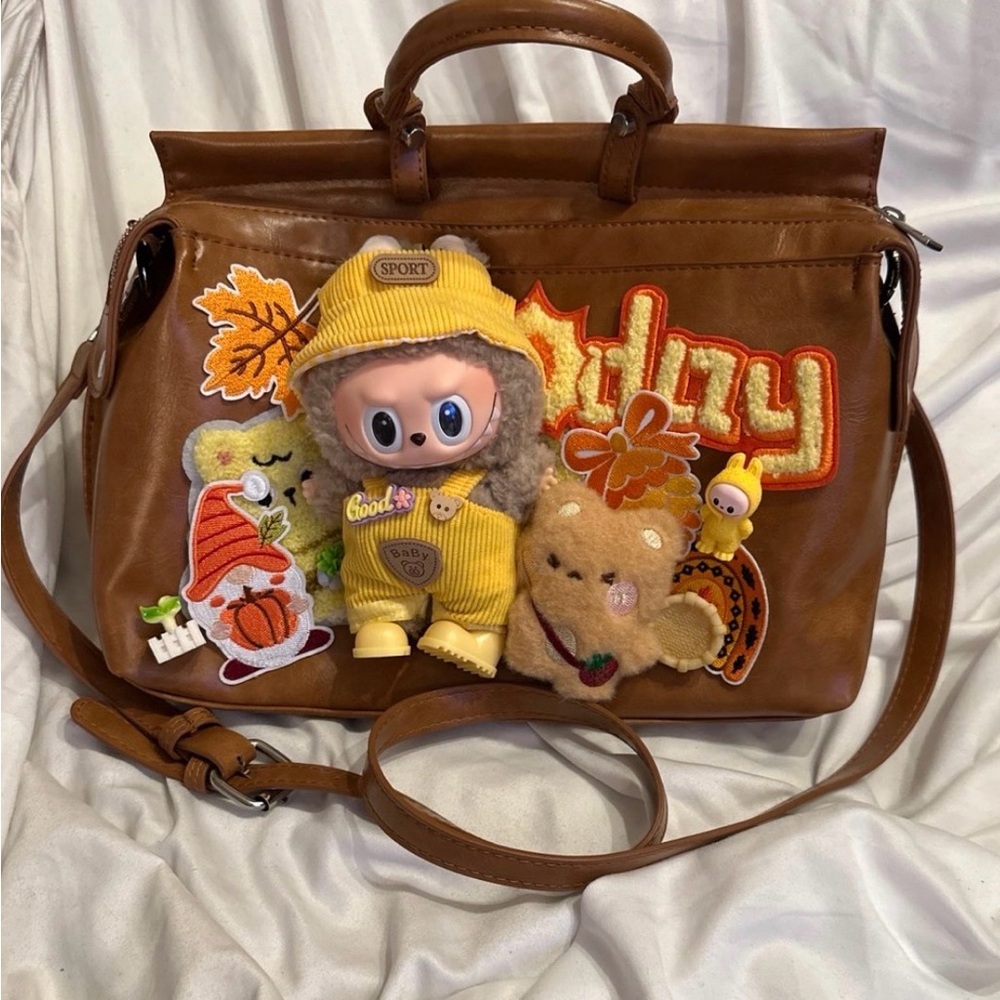 Stylish Brown Crossbody Bag with Playful Patches